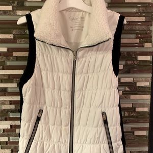 Calvin Klein vest white with black trim gold zippers and gold hardware. Size med